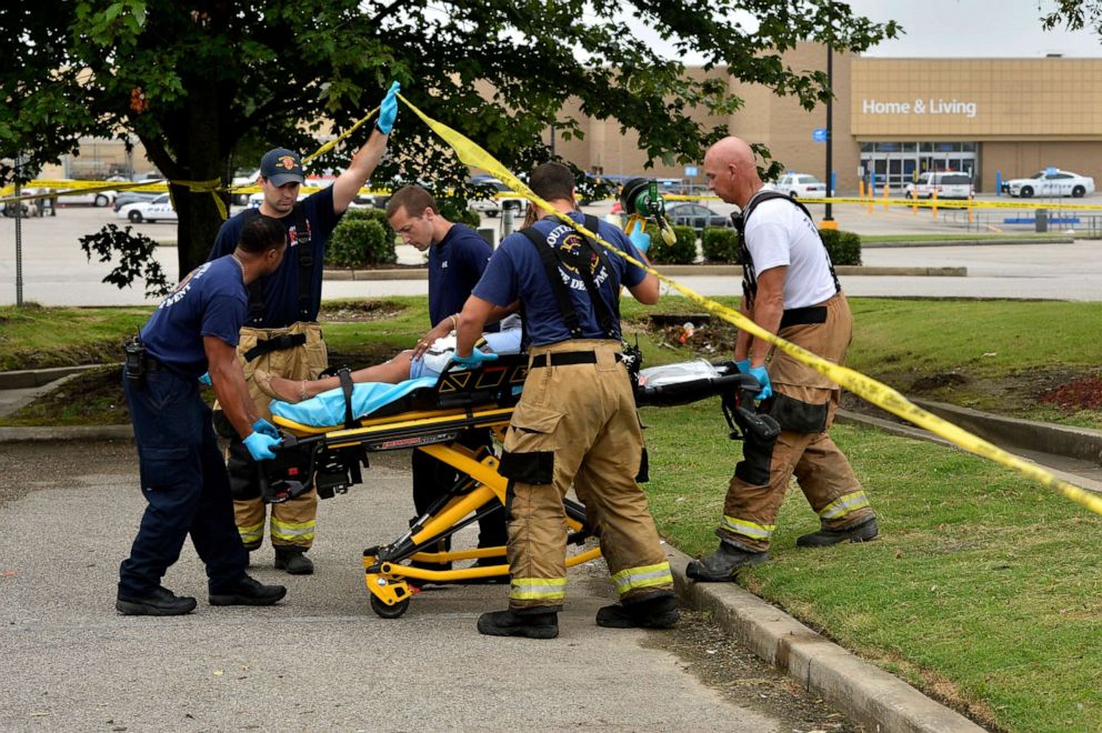 PHOTO: Paramedics offer medical attention after a shooting at a Walmart store Tuesday, July 30, 2019 in Southaven, Miss.