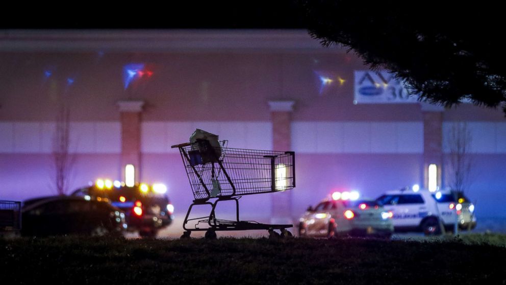 PHOTO: A shopping cart sits in the parking lot as police investigate the scene of a shooting at a Walmart store, Nov. 1, 2017 in Thornton, Colo. 