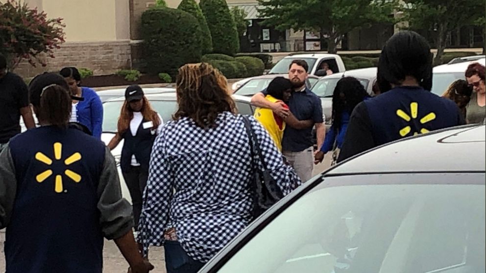 PHOTO:Walmart employees join in a prayer circle outside the store, July 30, 2019, in Southaven, Miss.