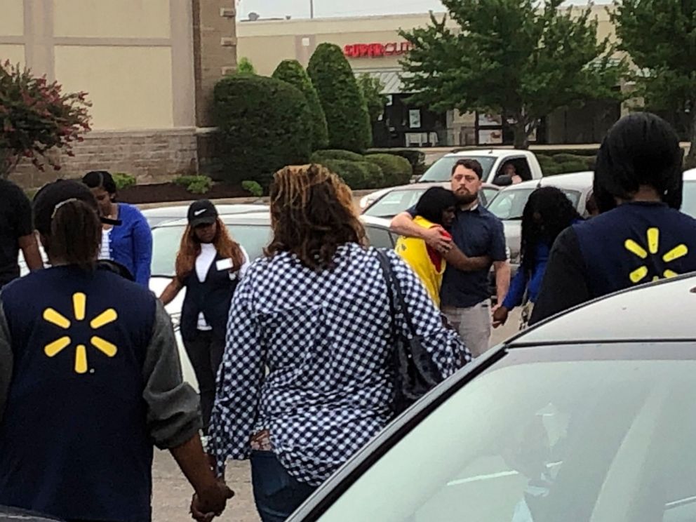 PHOTO:Walmart employees join in a prayer circle outside the store, July 30, 2019, in Southaven, Miss.
