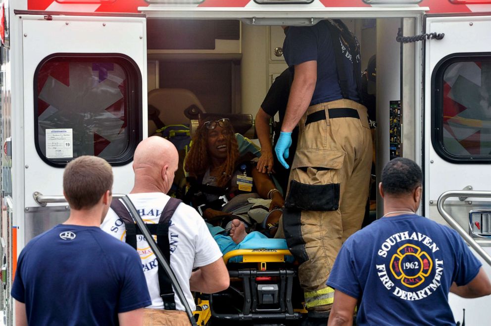 PHOTO: A Walmart employee receives medical attention after a shooting at the store,  July 30, 2019, in Southaven, Miss.