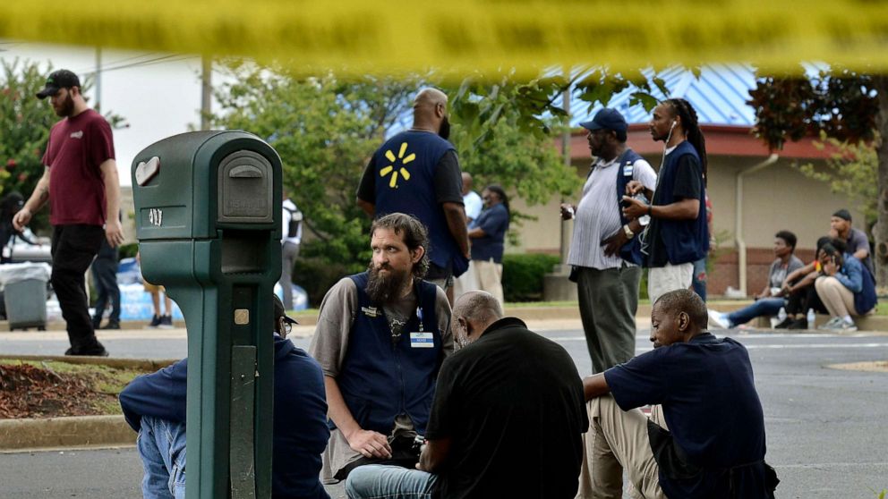 PHOTO: Employees gather in a nearby parking lot after a shooting at a Walmart store, July 30, 2019, in Southaven, Miss.