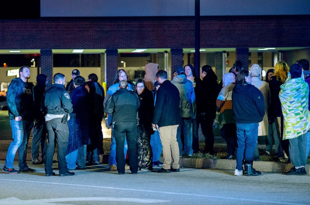 PHOTO: Witnesses are interviewed after a shooting at the West Side Walmart located at 335 S. Red Bank Road in Evansville, Ind., Jan. 20, 2023.