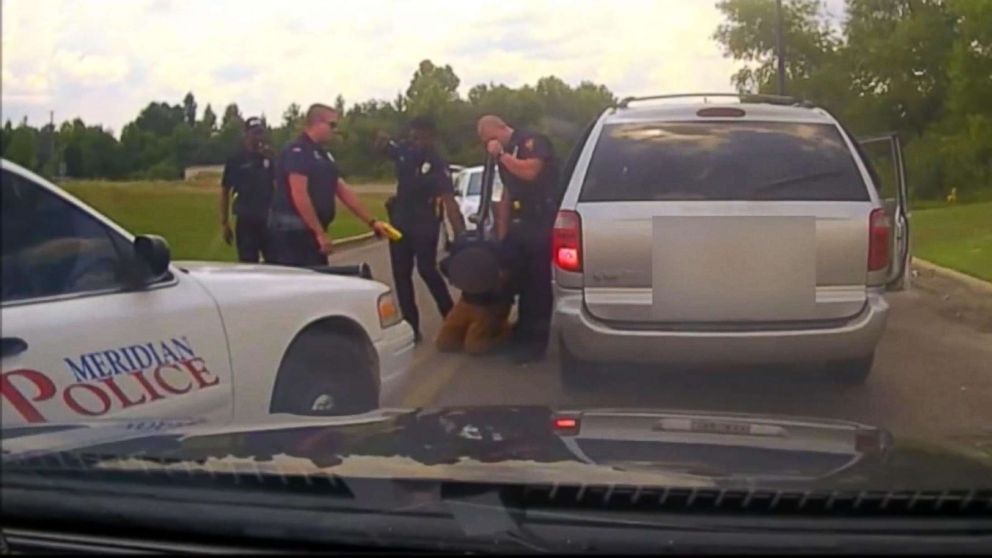 PHOTO: Meridian Police officer Daniel Starks pointed his stun gun at the suspect for a second time after shocking him in the shoulder while he was handcuffed on July 16. 