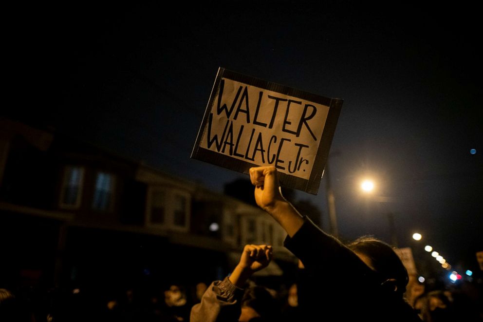 PHOTO: Demonstrators hold placards reading "WALTER WALLACE JR." during a protest near the location where Walter Wallace Jr. was killed by two police officers on Oct. 27, 2020 in Philadelphia.