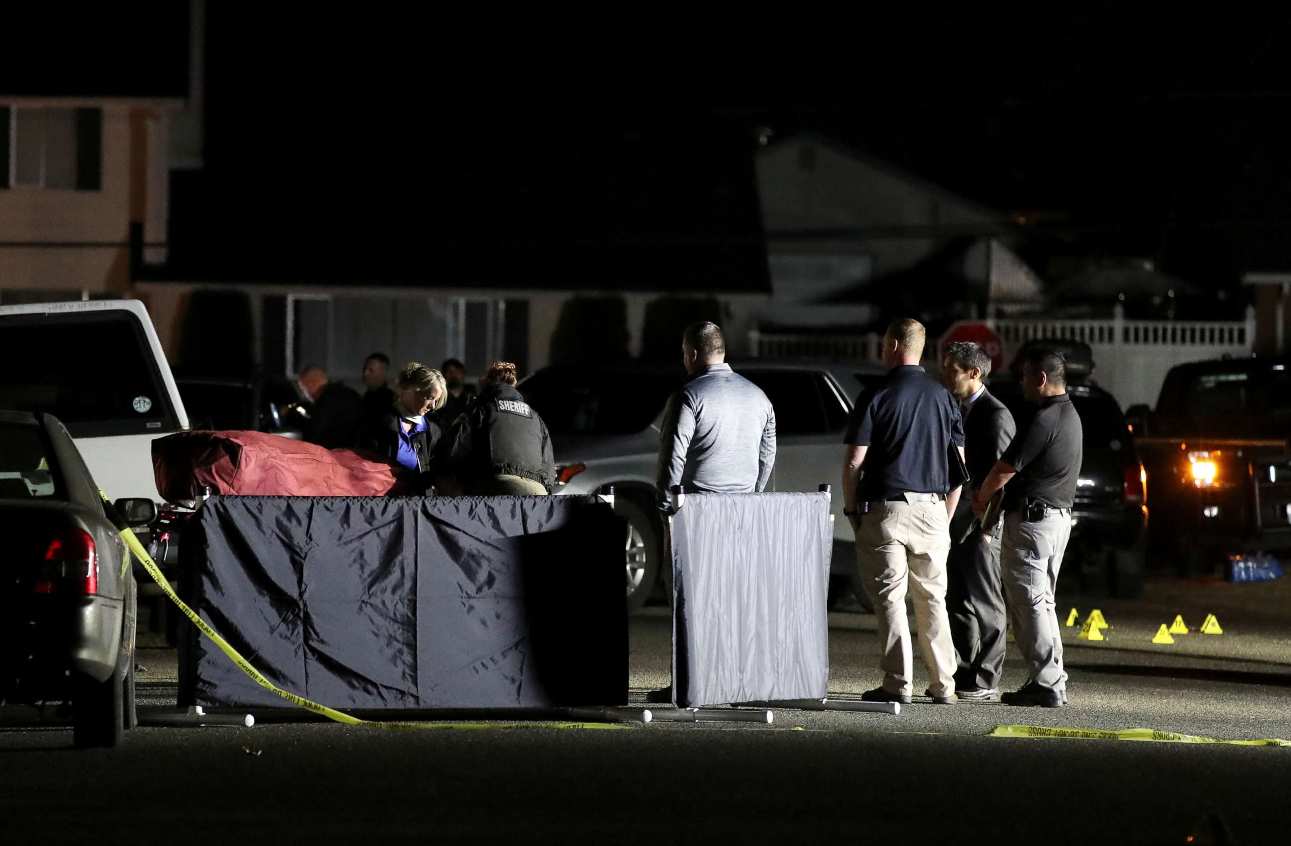 PHOTO: Investigators move the body at Tanglewilde Terrace, where law enforcement officers shot a man reported to be Michael Forest Reinoehl, in Lacey, Washington, Sept. 4, 2020.