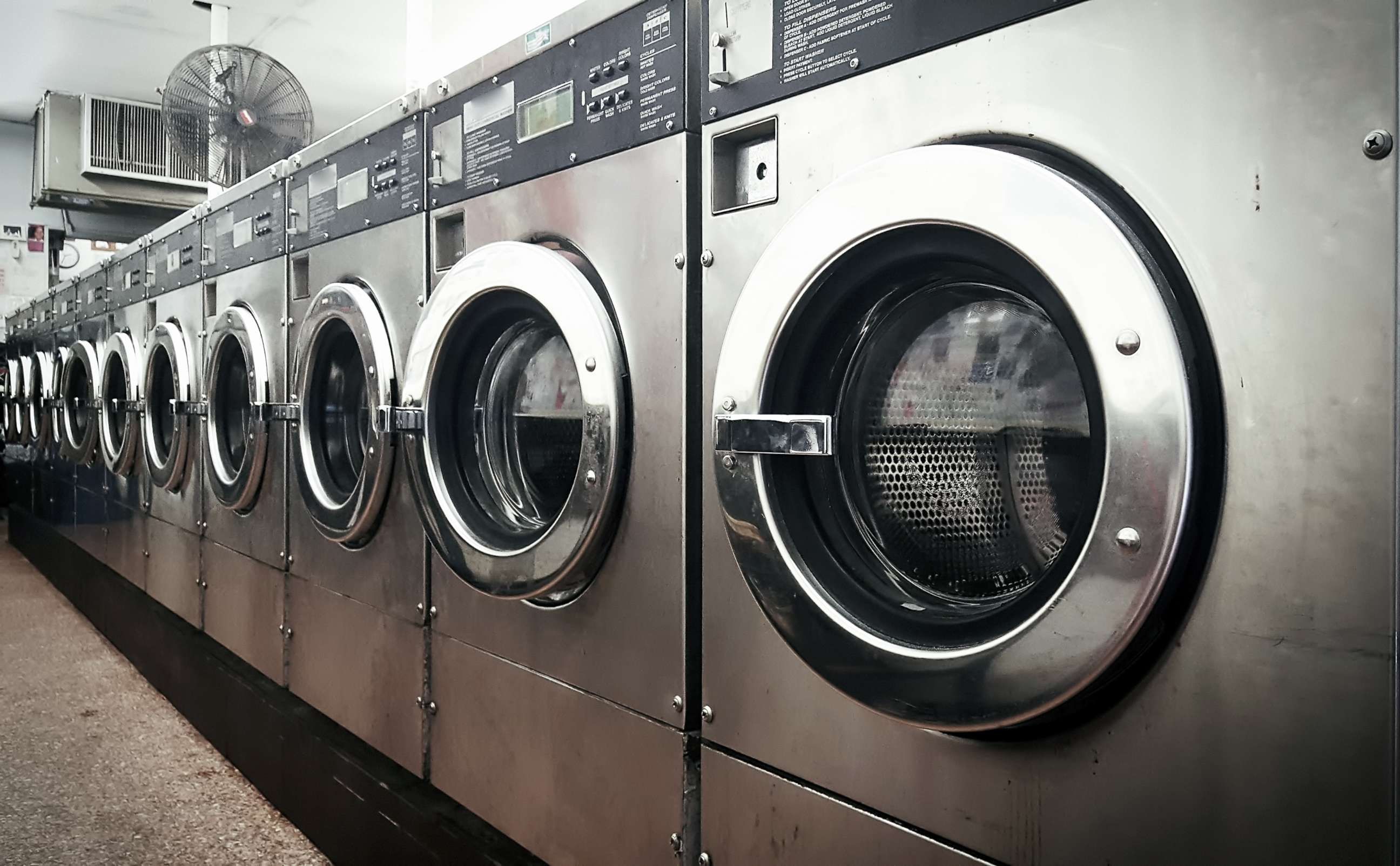 PHOTO: A row of washers at a laundromat in New York City.