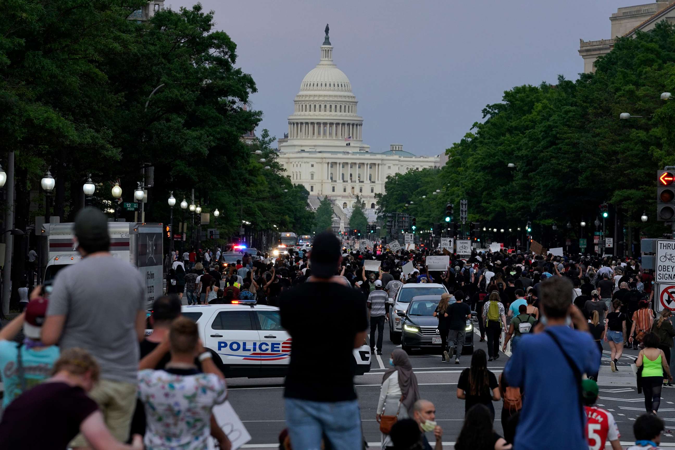 PHOTO: Demonstrators walk along Pennsylvania Avenue as they protest the death of George Floyd, a black man who died in police custody, May 29, 2020, in Washington, D.C. 