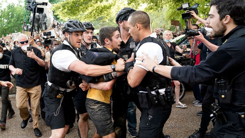 PHOTO: Uniformed U.S. Secret Service police detain a protester in Lafayette Park across from the White House as demonstrators protest the death of George Floyd, a black man who died in police custody, May 29, 2020, in Washington, D.C.