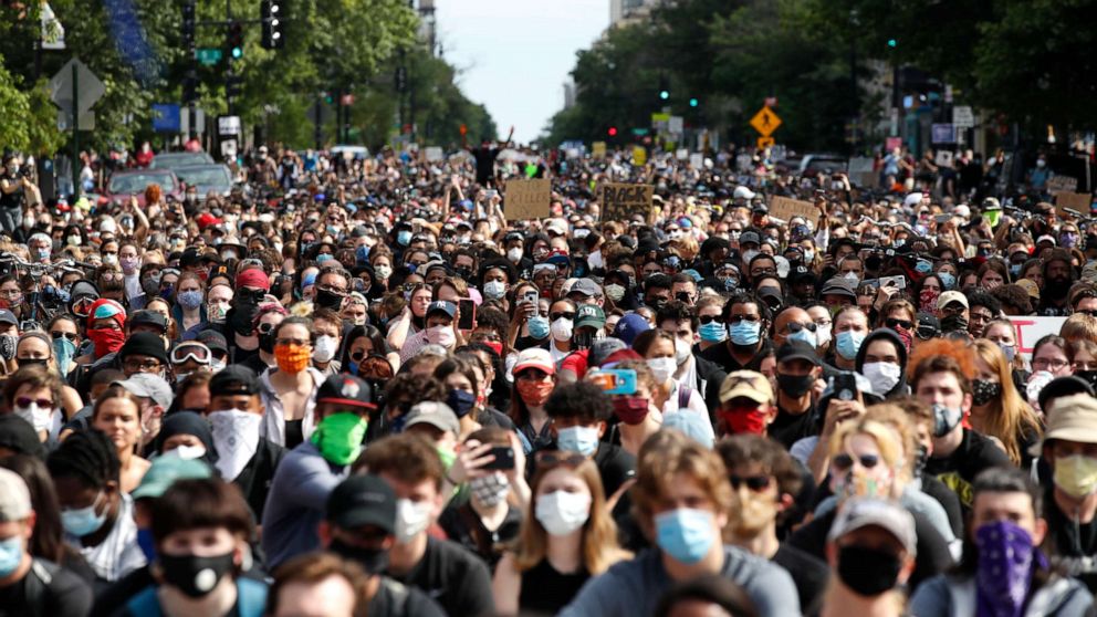 PHOTO: Demonstrators pause to kneel as they march to protest the death of George Floyd, Tuesday, June 2, 2020, in Washington. Floyd died after being restrained by Minneapolis police officers. (AP Photo/Alex Brandon)
