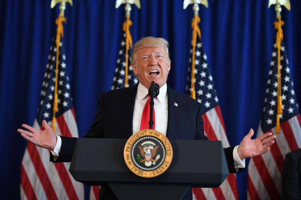 PHOTO: President Donald Trump speaks to the press gathered at Trump National Golf Club in Bedminster, N.J. about protests in Charlottesville on Aug. 12, 2017.