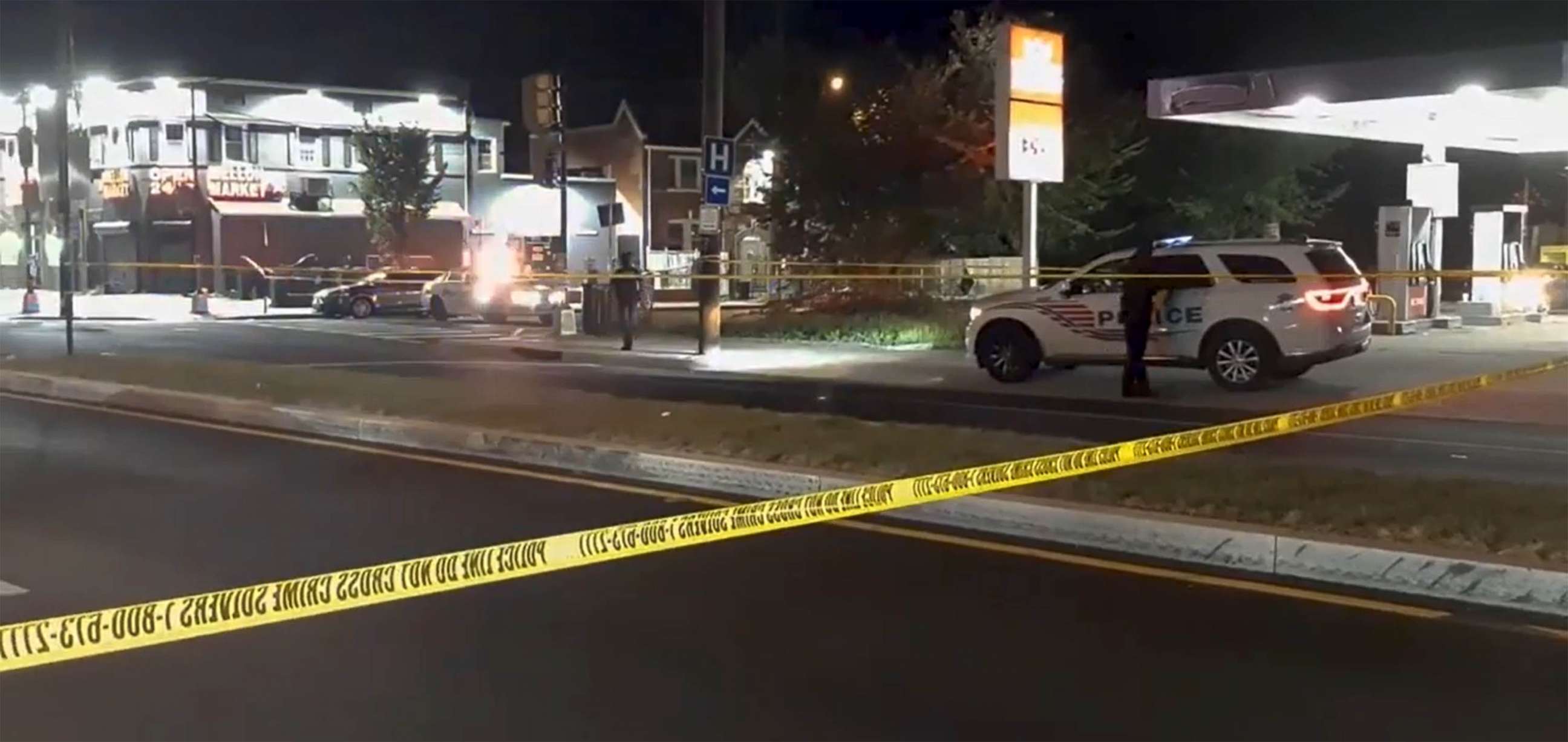 PHOTO: Police respond to a shooting at the  intersection of Malcolm X and Martin Luther King Avenues in the Congress Heights are of Southeast Washington, July 16, 2021.