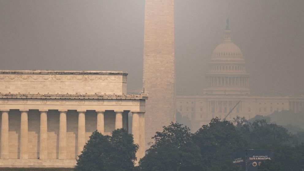 PHOTO: The US Capitol, Washington Monument and Lincoln Memorial are seen through haze caused by wildfire smoke from Canada from the Netherlands Carillon in Arlington, Virginia on July 17, 2026. 