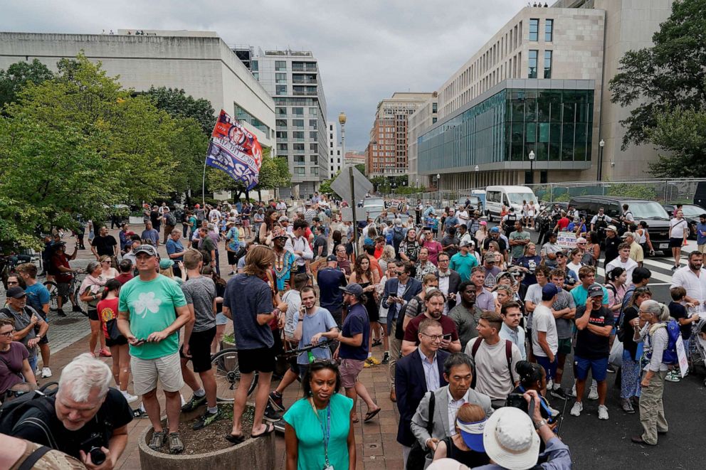 PHOTO: People gather on the day former U.S. President Donald Trump, who is facing federal charges related to attempts to overturn his 2020 election defeat, appears at the U.S. District Court in Washington, Aug. 3, 2023.