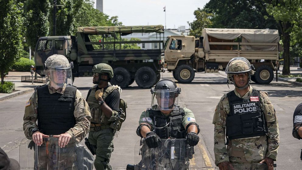 PHOTO: Police forces and National Guard vehicles are used to block 16th Street near Lafayette Park and the White House on June 3, 2020.