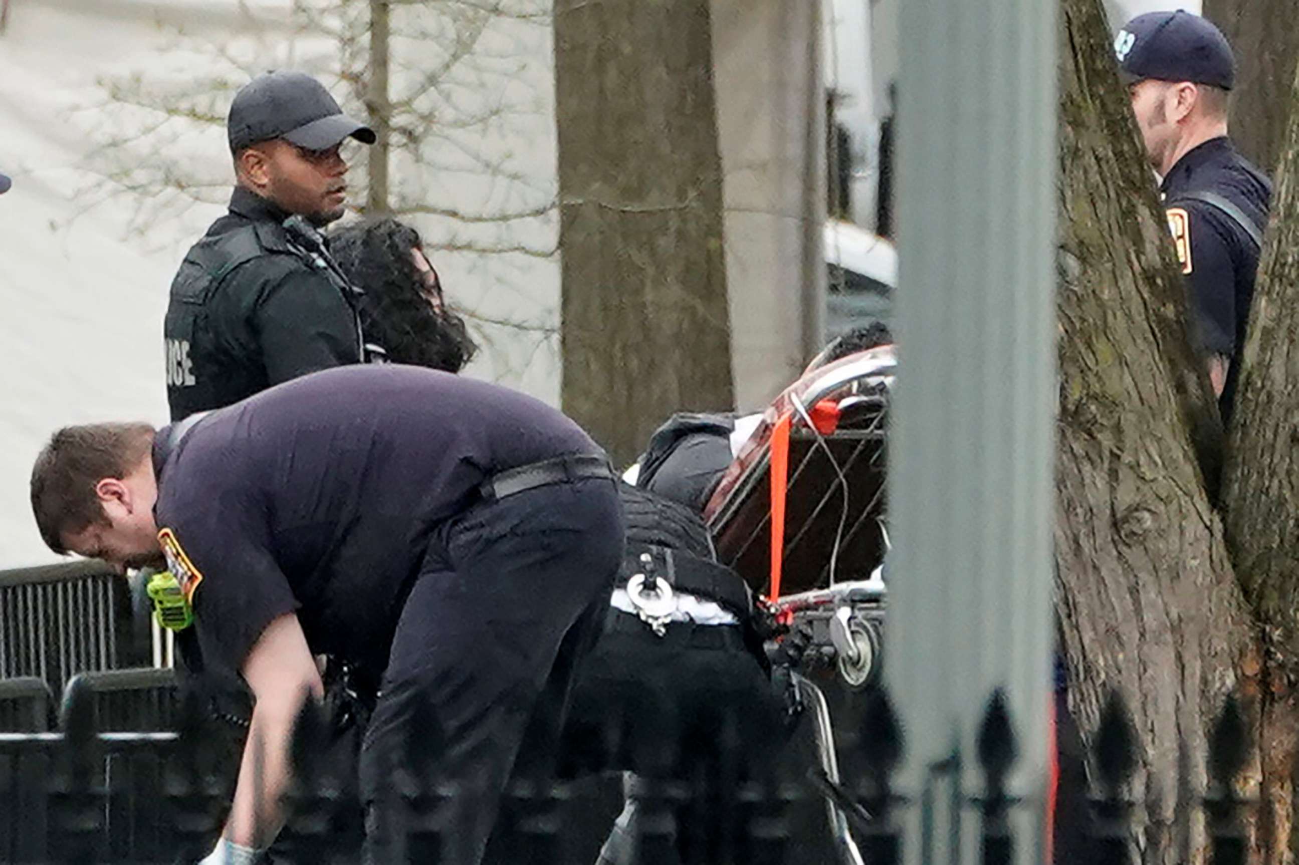 PHOTO: Police and rescue personnel remove a man on a stretcher from Lafayette Park after the man lit his jacket on fire in front of the White House in Washington, April 12, 2019.