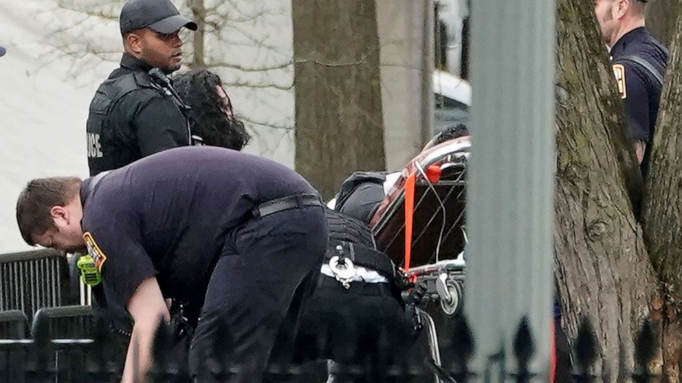 PHOTO: Police and rescue personnel remove a man on a stretcher from Lafayette Park after the man lit his jacket on fire in front of the White House in Washington, April 12, 2019.
