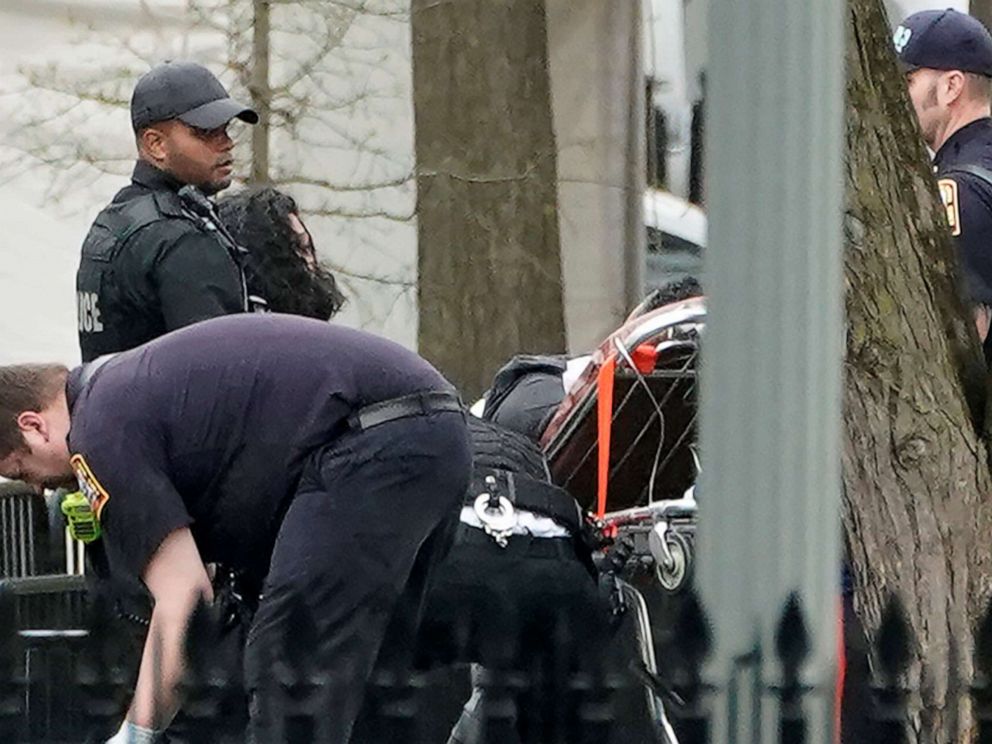 PHOTO: Police and rescue personnel remove a man on a stretcher from Lafayette Park after the man lit his jacket on fire in front of the White House in Washington, April 12, 2019.
