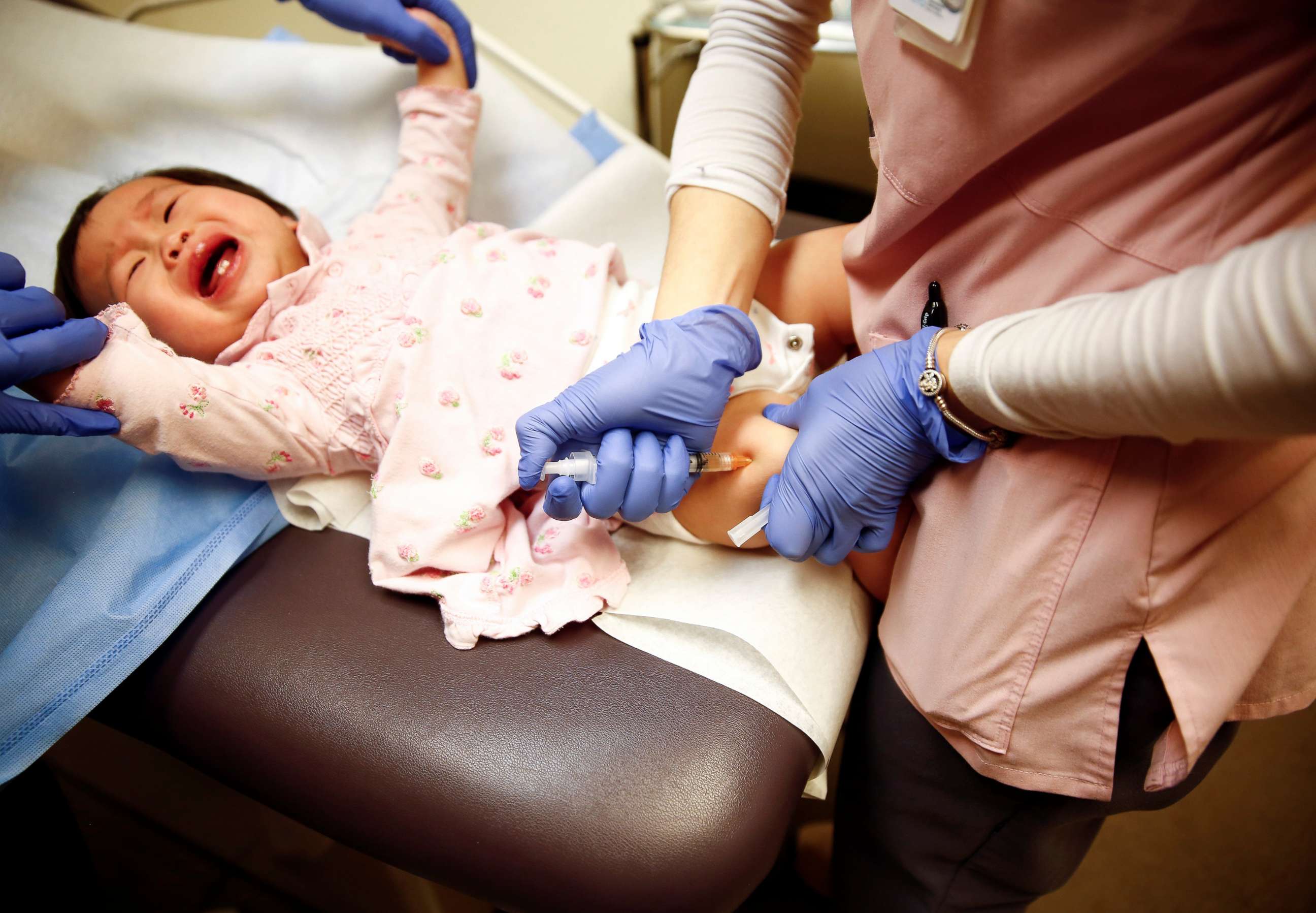 PHOTO: A medical worker administers the vaccine for measles, mumps, and rubella to one-year-old Bella Huang at the International Community Health Services clinic in Seattle, March 20, 2019.