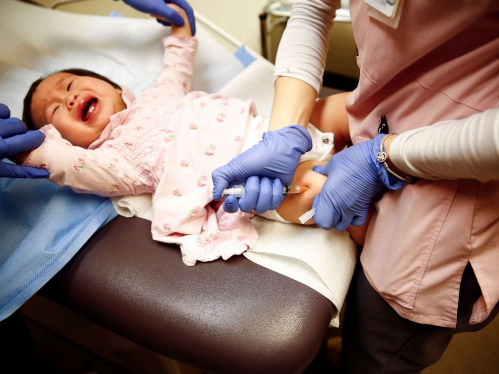 PHOTO: A medical worker administers the vaccine for measles, mumps, and rubella to one-year-old Bella Huang at the International Community Health Services clinic in Seattle, March 20, 2019.