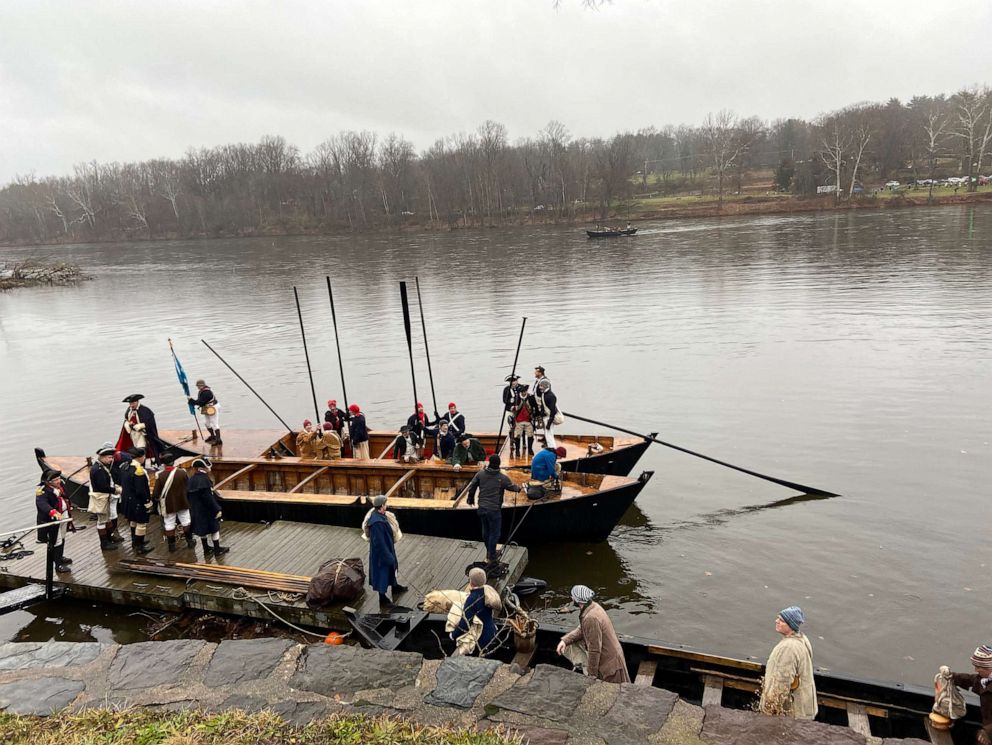 PHOTO: Reenactors participate in George Washington's crossing of the Delaware River in Bucks County, Pennsylvania, on Dec. 11, 2022.