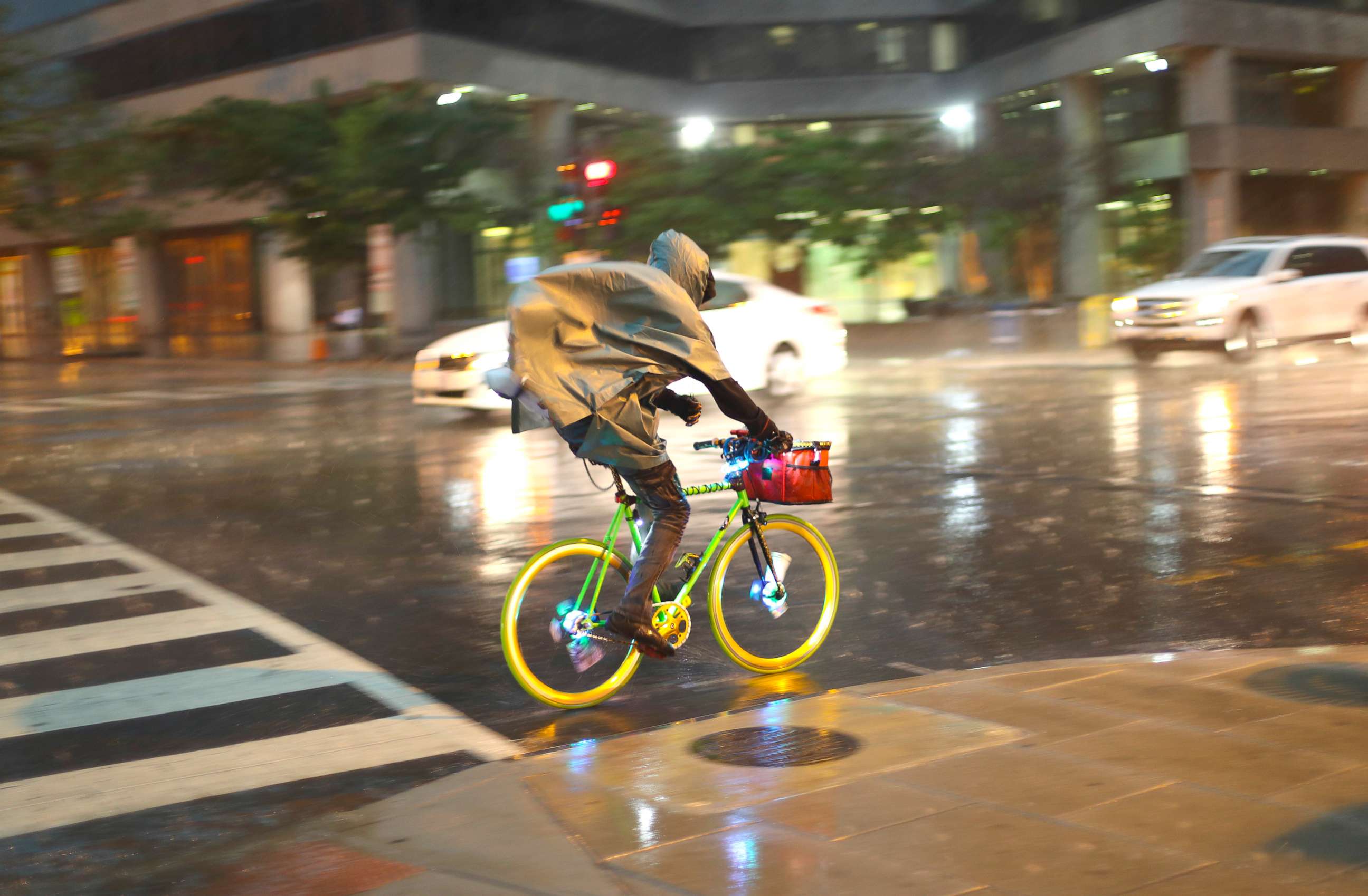 PHOTO: A bicyclist rides is heavy rainfall in downtown Washington, May 14, 2018.