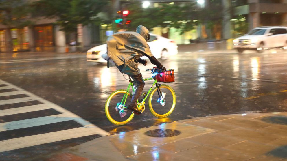 PHOTO: A bicyclist rides is heavy rainfall in downtown Washington, May 14, 2018.