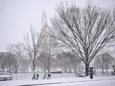 Major winter storm covers 13 states, breaking snowfall records as it moves east