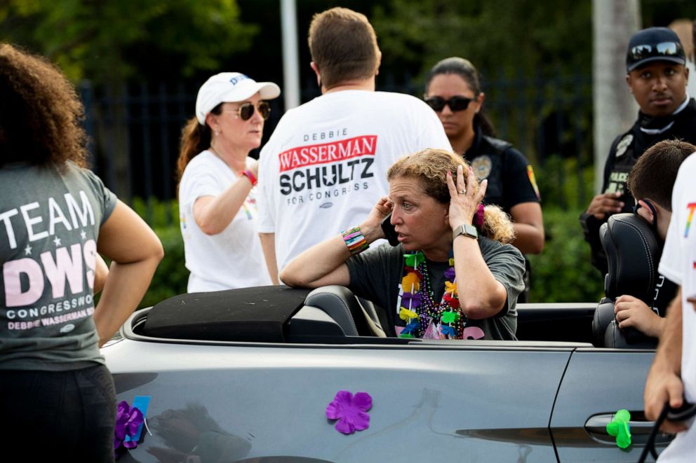PHOTO: Rep. Debbie Wasserman Schultz, D-Fla., makes a call after a truck drove into a crowd of people during The Stonewall Pride Parade and Street Festival in Wilton Manors, Fla., Saturday, June 19, 2021. 