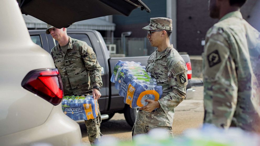 PHOTO: Members of the National Guard distribute water during a water shortage in Jackson, Miss., Sept. 2, 2022.