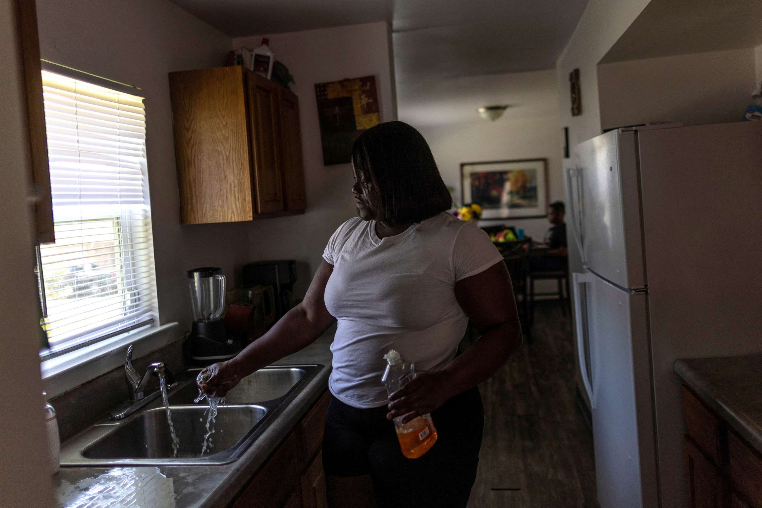 PHOTO: Water runs from a faucet at Deneka Samuel's kitchen, while the city of Jackson is to go without reliable drinking water indefinitely after pumps at the water treatment plant failed, in Jackson, Miss., Sept. 1, 2022.