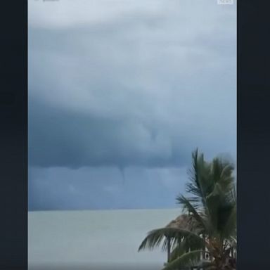 A waterspout was spotted swirling in the Florida Keys, with the National Weather Service estimating wind speeds of "at least 40 mph."