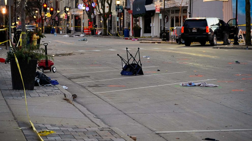 PHOTO: Crime scene evidence is seen on Main Street the morning after after a car plowed through a holiday parade in Waukesha, Wis., Nov. 22, 2021.