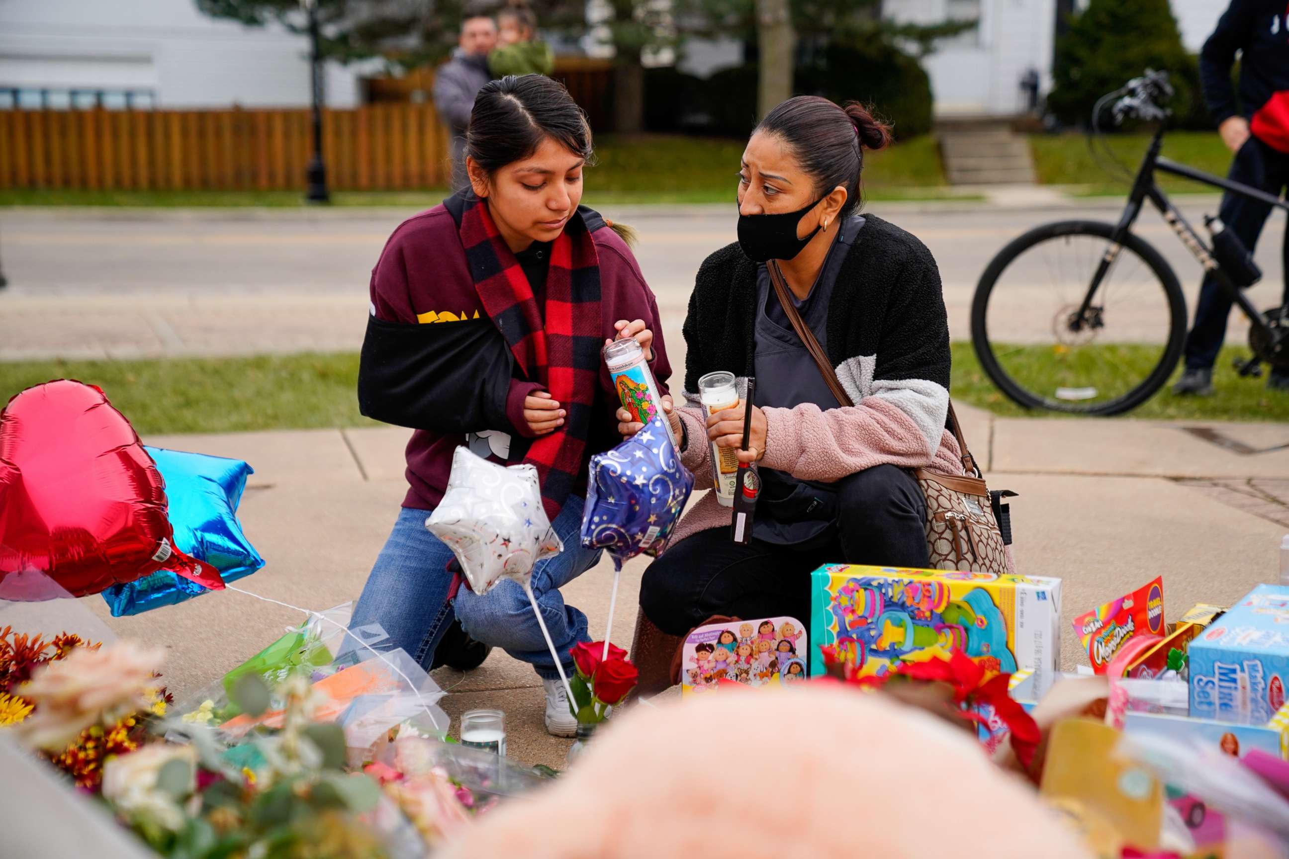 PHOTO: Sasha Catalan, 17, visits a memorial with her aunt Rocio Castillo after being injured when a car plowed through a holiday parade in Waukesha, Wisc., Nov. 24, 2021.
