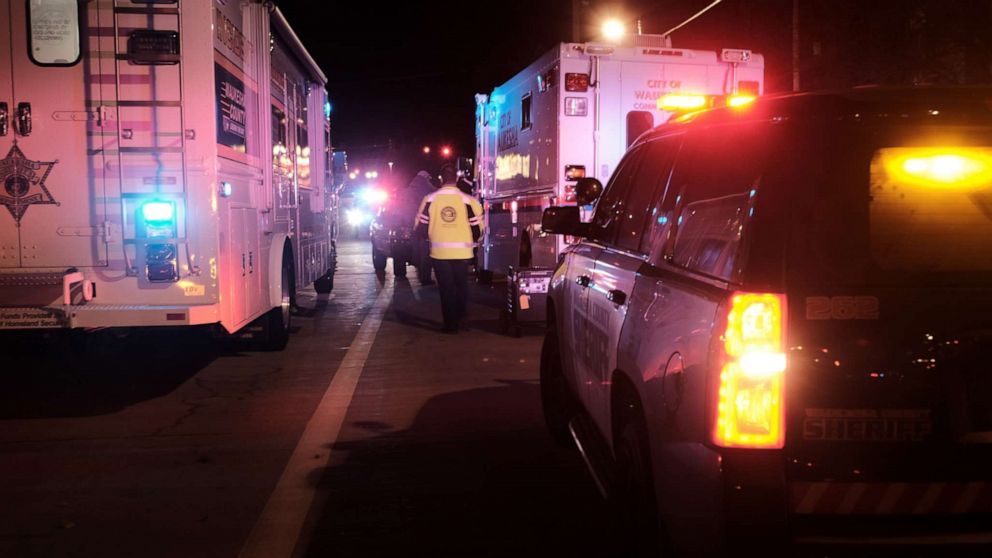PHOTO: Emergency personnel tend to victims after a car plowed through a holiday parade in Waukesha, Wisc., Nov. 21, 2021.