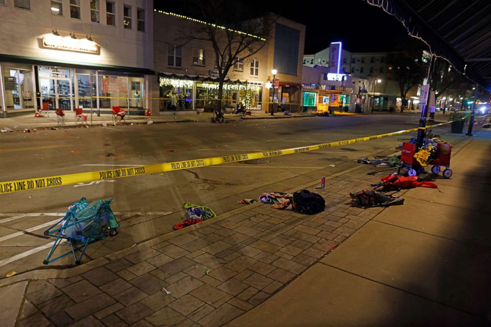 PHOTO: Police tape cordons off a street in Waukesha, Wis., after a vehicle plowed into a Christmas parade, injuring at least 20 people and killing some, according to police, Nov. 21, 2021.