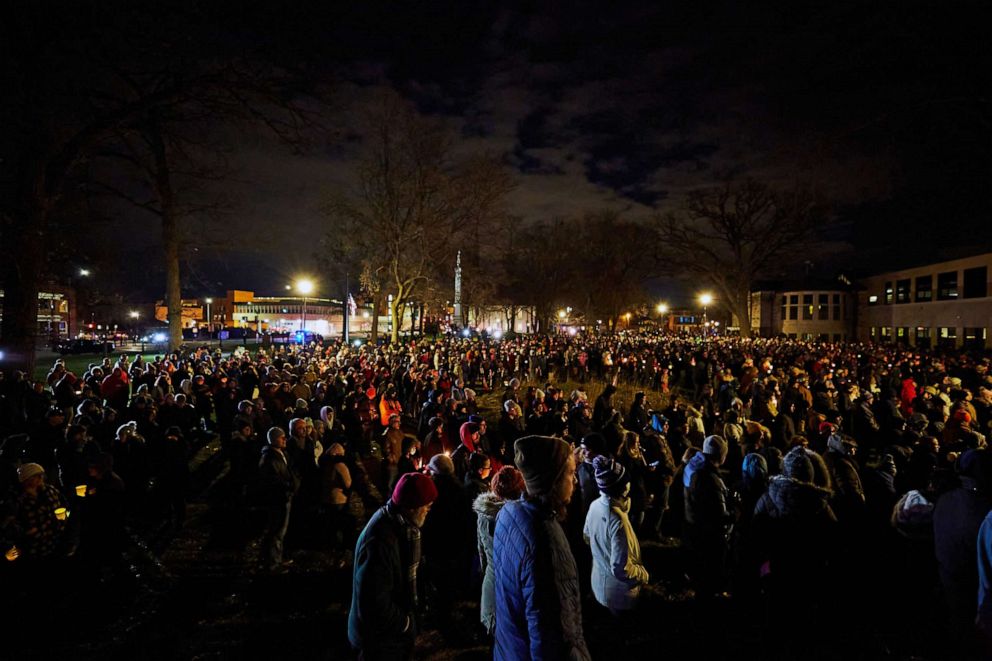 PHOTO: People attend a candle light vigil held in Cutler Park in Waukesha, Wisc., on Nov. 22, 2021, the day after a vehicle drove through a Christmas parade killing several people.