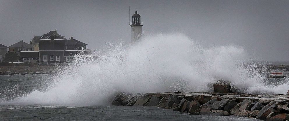 PHOTO: Waves break over the harbor jetty at the entrance to Scituate Harbor, in Quincy, Mass., as a nor'easter bears down, Oct. 26, 2021.
