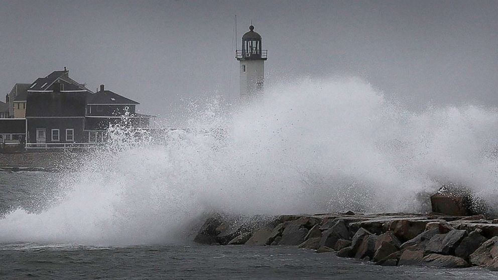 PHOTO: Waves break over the harbor jetty at the entrance to Scituate Harbor, in Quincy, Mass., as a nor'easter bears down, Oct. 26, 2021.