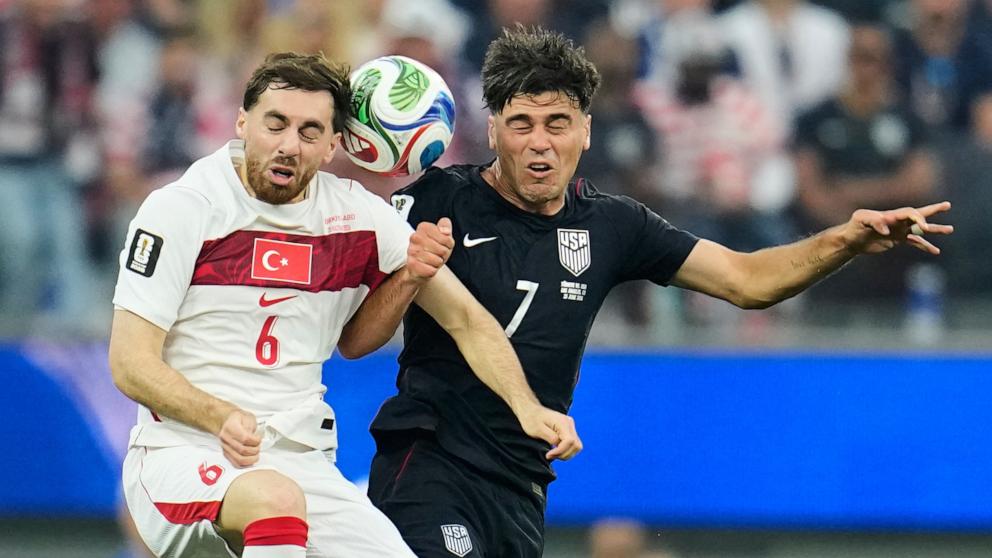 PHOTO: United States' Giovanni Reyna and Turkey's Orkun Kokcu battle for the ball during their FIFA World Cup 2026 Group D soccer match in Los Angeles, June 25, 2026. 