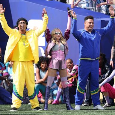 PHOTO: Madonna performs flanked by former Brazilian soccer players Ronaldinho (L) and Ronaldo during the halftime show for the FIFA World Cup 2026 final match in New Jersey, July 19, 2026.