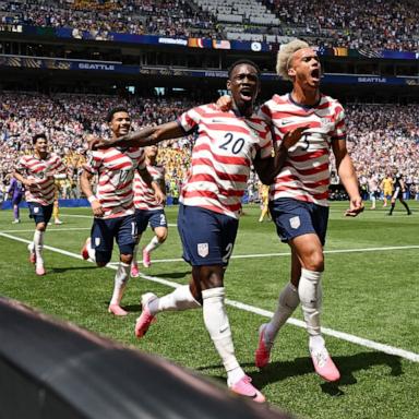 PHOTO: Folarin Balogun and Antonee Robinson of the USA celebrate after Australia's Cameron Burgess scores an own goal during their FIFA World Cup 2026 Group D match, June 19, 2026 in Seattle, Washington.
