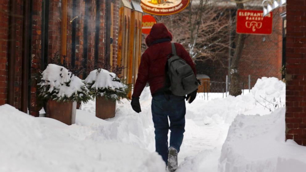 PHOTO: A person walks in the snow after a storm in Portsmouth, N.H., Jan. 26, 2026.