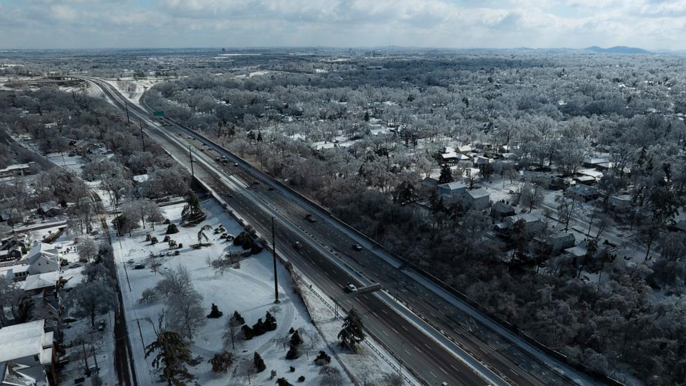 PHOTO: Aerial view shows ice and snow accumulated on houses, trees and utility lines on January 26, 2026 in Nashville, Tennessee.
