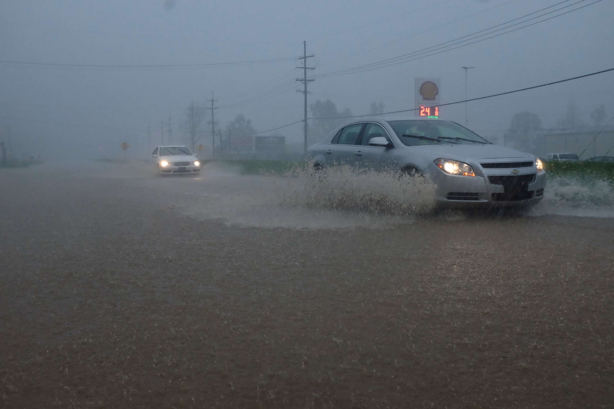 PHOTO: Vehicles travel through a flooded section of Highway 61 South following severe weather, April 13, 2019, in Vicksburg, Miss. 