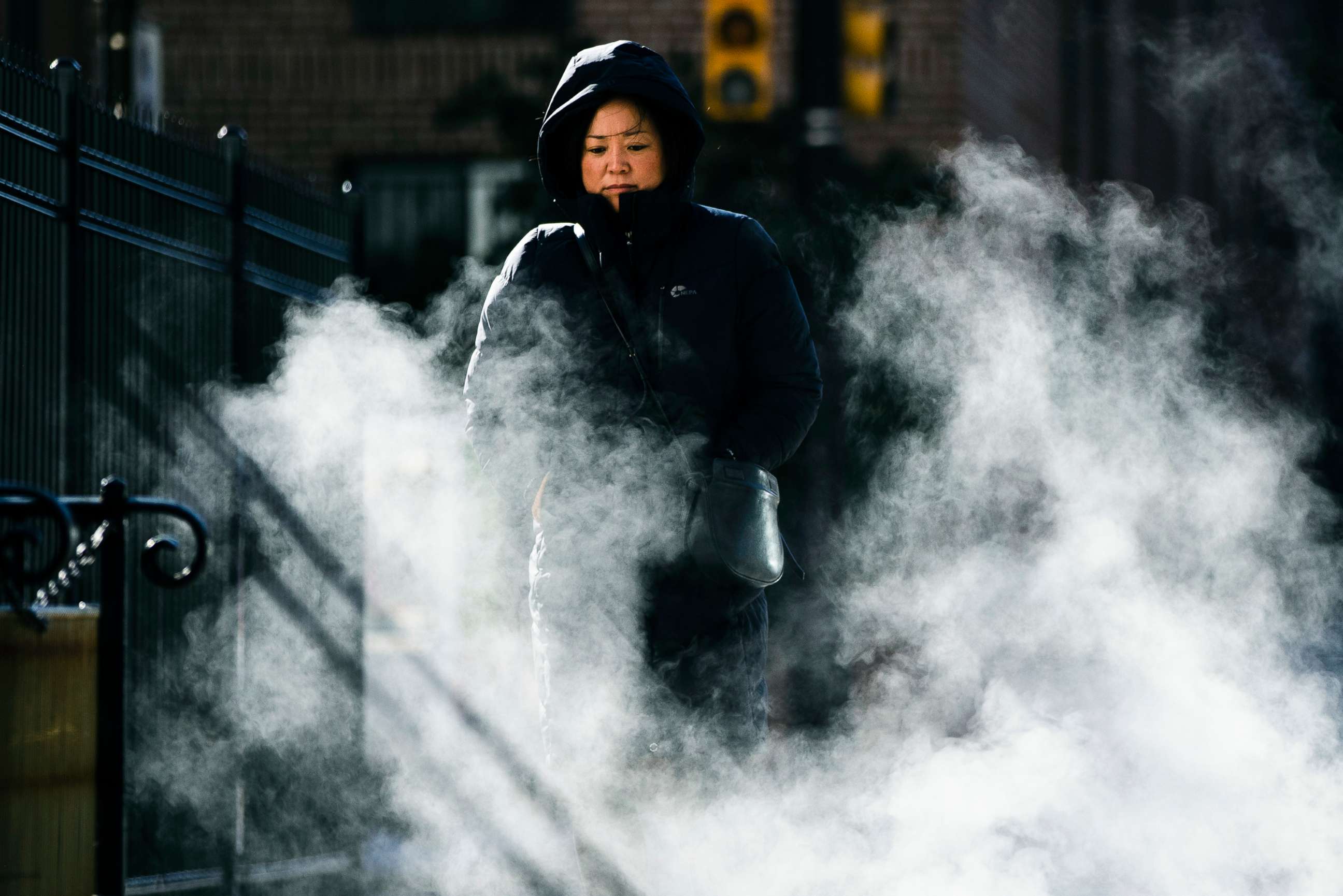PHOTO: A woman bundled up against the cold walks in Philadelphia, Nov. 13, 2019. An arctic blast that sent shivers across the Midwest spread to the eastern U.S. on Wednesday. 