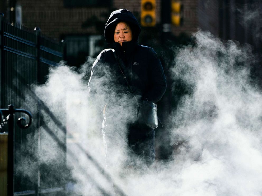 PHOTO: A woman bundled up against the cold walks in Philadelphia, Nov. 13, 2019. An arctic blast that sent shivers across the Midwest spread to the eastern U.S. on Wednesday. 