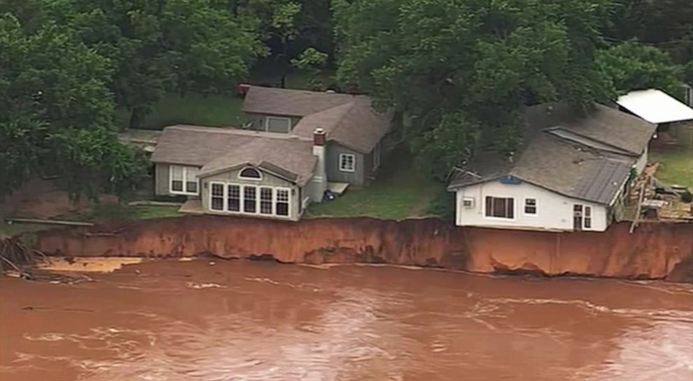 PHOTO: This image taken from video provided by KOCO-5 shows homes dangerously close to the Cimarron River, May 22, 2019, near Crescent, Oka. 