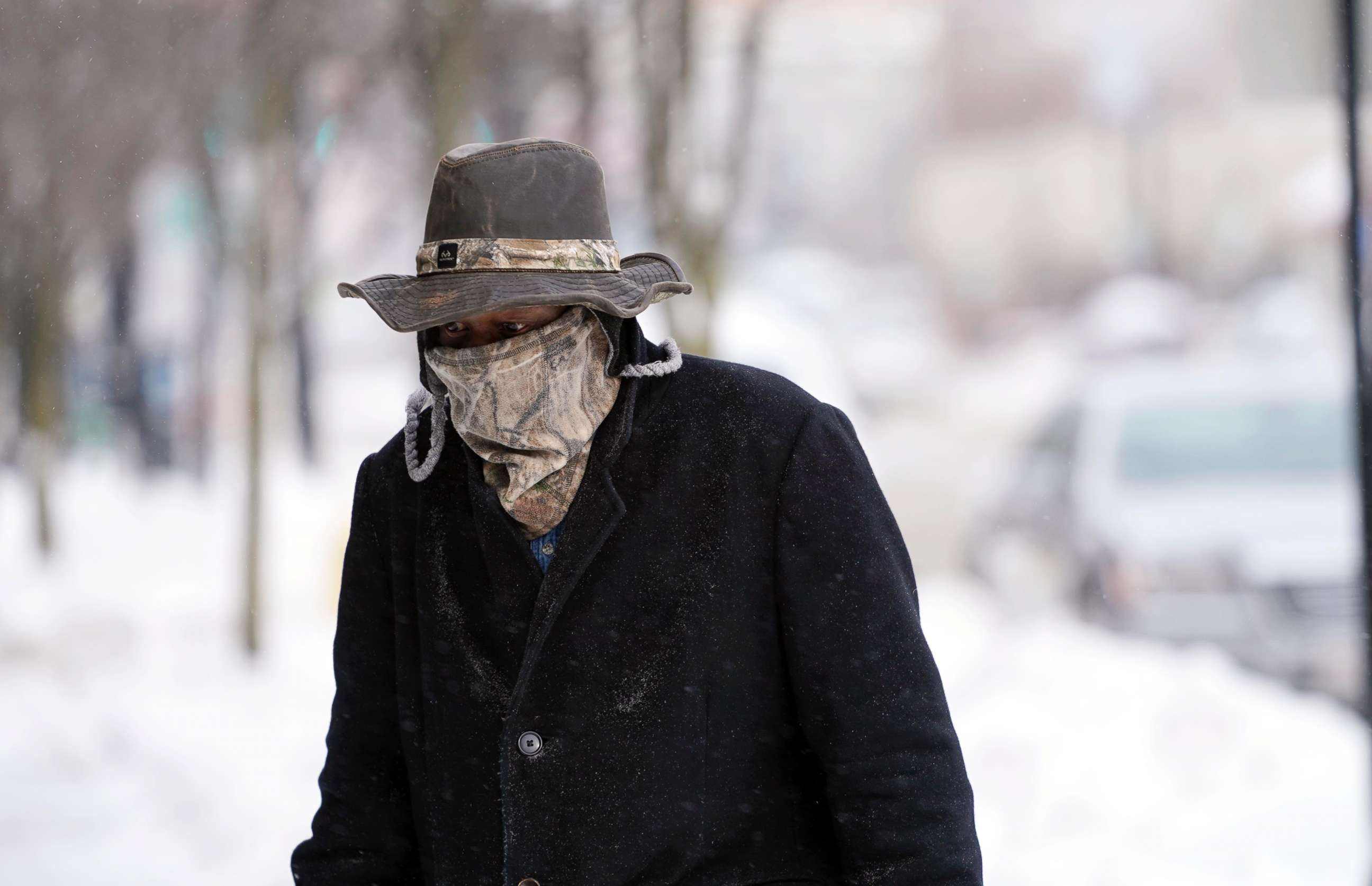 PHOTO: Marvin Hooks wears a face mask to protect him from the cold as he walks on North Street in Pittsfield, Mass., Jan. 21, 2019.