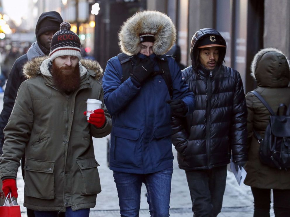 PHOTO: Pedestrians walk along Michigan Avenue in Chicago, Dec. 27, 2017. Frigid temperatures are expected in the single digits in the midwest over the next few days.